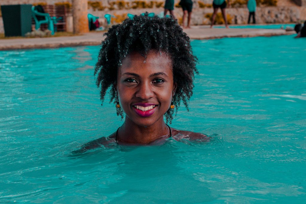 Swimming at Olkaria Geothermal spa, It's hot, and the water is turqoise blue in colour