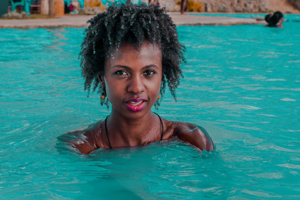 Swimming at Olkaria Geothermal spa, It's hot, and the water is turqoise blue in colour